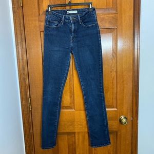 Levi’s mid-rise skinny jeans. Dark wash.